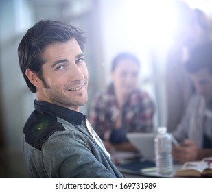 Portrait of smiling businessman in meeting