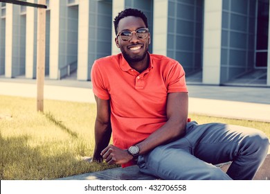 Portrait Of Smiling Casual Black Man In Red Tshirt.