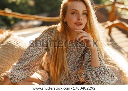 Portrait smiling caucasian female with long blond  look at the camera