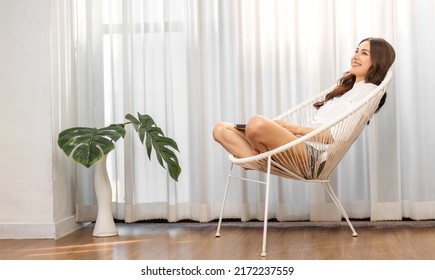 Portrait Of Smiling Cheerful Beautiful Pretty Asian Woman Clean Fresh Healthy White Skin Posing Smile In Pajamas White Clothes.Girl Felling Relax And Enjoy Time On The Bed At Home.asia Beauty