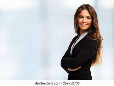 Portrait of a smiling cheerful business woman. Bright background