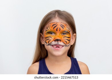 Portrait Smiling Child With Tiger Face Painting