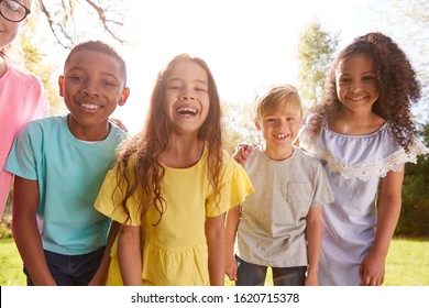 Portrait Of Smiling Children Outdoors At Home Looking Into Camera - Shutterstock ID 1620715378