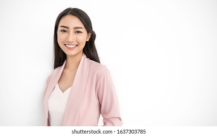 Portrait Of Smiling Confident Asian Business Designer Woman Pink Suit Office. Asian Business Girl. Startup Successful Power Business Leader Executive People Looking Camera Copy Space Isolated On White