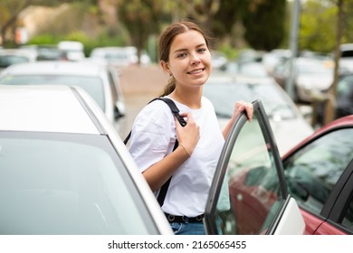 Portrait Of A Smiling, Confident Girl In The Parking Lot, About To Get Into Her Car