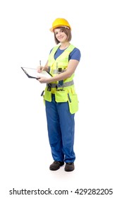 Portrait Of Smiling Construction Female Worker In Yellow Helmet And Reflective Vest Holding A Clipboard And Pen Isolated On White Background