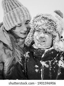 Portrait of smiling couple in love. Young happy couple walking in winter day. Black and white