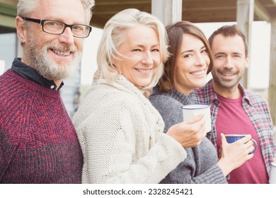 Portrait smiling couples drinking coffee outdoors - Powered by Shutterstock
