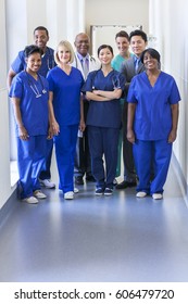 Portrait Of Smiling Dedicated Multi Ethnic Male Female Clinical Nursing And Management Team In Medical Centre