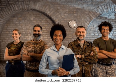 Portrait of smiling diverse veterans at PTSD support group. - Powered by Shutterstock