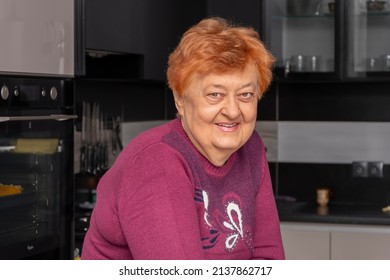 Portrait of a smiling elderly woman over 70 years old, with gray hair, on the background of a home interior. Concept: stylish pensioners of model appearance, - Shutterstock ID 2137862717