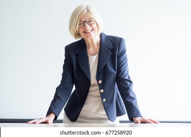 Portrait Of Smiling Elegant Senior Female Leader