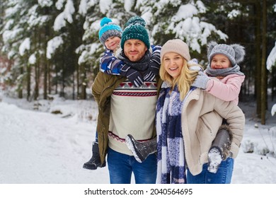 Portrait of smiling family at winter day
