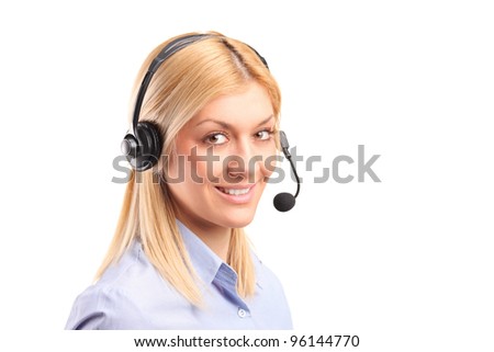Portrait of a smiling female customer service operator wearing a headset isolated against white background