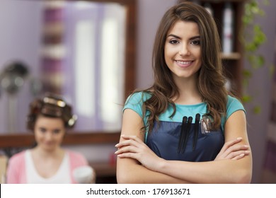 Portrait of smiling female hairdresser - Powered by Shutterstock