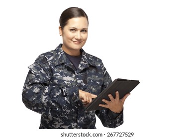 Portrait Of Smiling Female Navy Sailor With Digital Tablet Against White Background