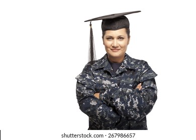 Portrait Of Smiling Female Navy Sailor Wearing Graduation Cap