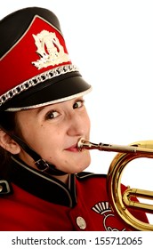 Portrait Of Smiling Female Teenager In  Red And Black Marching Band Uniform With Mellophone Isolated On White Background