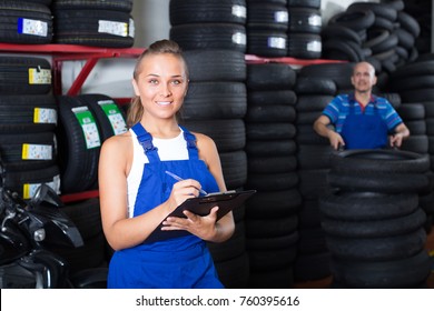 portrait of smiling girl in protective workwear working as auto mechanic in workshop
 - Powered by Shutterstock