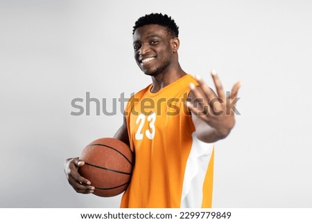 Similar – Image, Stock Photo Portrait of positive basketball player training on street court