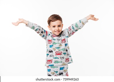 Portrait of a smiling happy little kid standing with hands outstreched isolated over white background