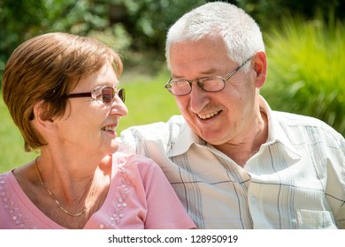 Portrait Of Smiling Happy Senior Couple - Outdoor On Sunny Day