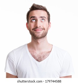 Portrait Of Smiling Happy Young Man Looking Up - Isolated On White.