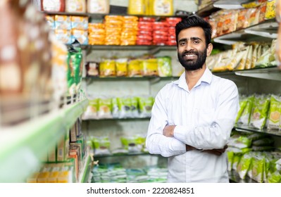 portrait of  smiling indian male in grocery with positive attitude   - Shutterstock ID 2220824851