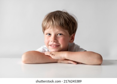Portrait Of A Smiling Little Boy On A White Background