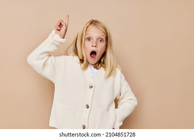 Portrait Of A Smiling Little Cutie With Blond Hair Cropped View