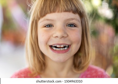 Portrait of smiling little girl with braces
