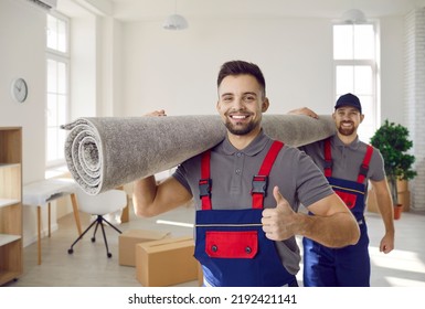 Portrait of smiling male movers carry carpet recommend good quality delivery or transportation service. Happy deliverymen or carriers help customer with moving or relocation. Shipping.