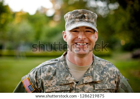 Portrait of a smiling male soldier.