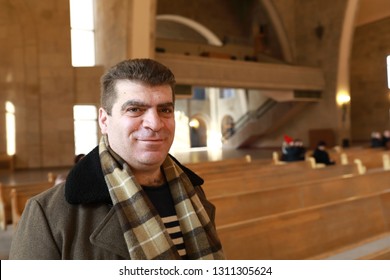 Portrait Of Smiling Man In Armenian Church