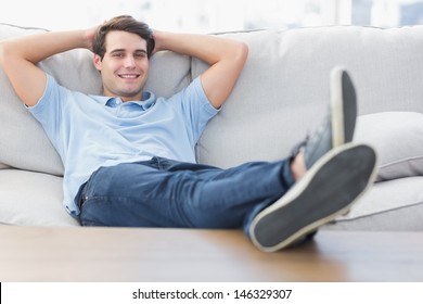 Portrait of a smiling man relaxing on the couch