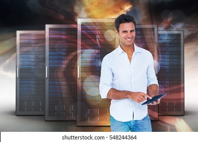 Portrait of smiling man using tablet computer against red vortex with orange light 3d