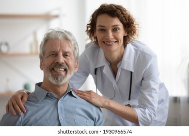 Portrait of smiling mature Caucasian male patient with young female caregiver or nurse at home visit. Happy senior man with caring woman nurse feel optimistic. Geriatric, elderly healthcare concept. - Powered by Shutterstock