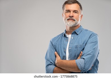 Portrait of smiling mature man standing on white background. - Shutterstock ID 1775868875