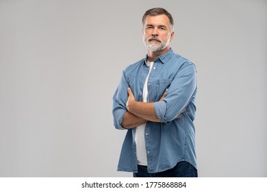 Portrait of smiling mature man standing on white background. - Shutterstock ID 1775868884