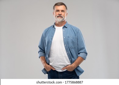 Portrait of smiling mature man standing on white background. - Powered by Shutterstock