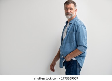 Portrait Of Smiling Mature Man Standing On White Background.