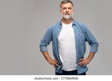 Portrait of smiling mature man standing on white background. - Shutterstock ID 1775869046
