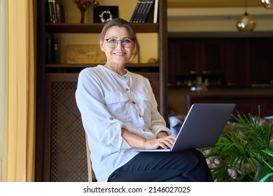 Portrait Of Smiling Middle Aged Business Woman Looking At Camera.