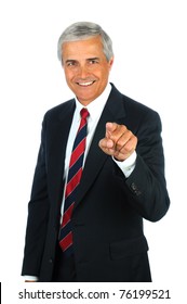 Portrait of a smiling middle aged business pointing at the viewer. Vertical format isolated on white.