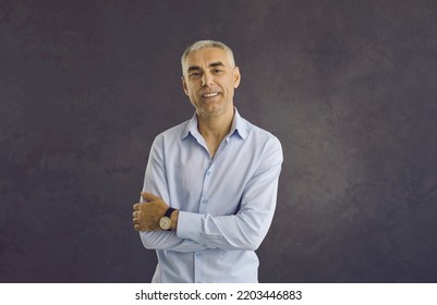 Portrait of smiling middle aged Caucasian man on black studio background feel confident. Headshot picture of happy older male boss or businessman look at camera show leadership optimism. - Powered by Shutterstock
