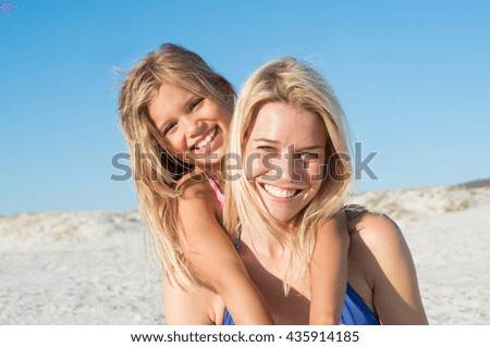 Similar – Image, Stock Photo Sisters enjoying piggyback ride