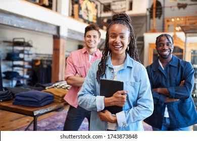 Portrait Of Smiling Multi-Cultural Sales Team In Fashion Store In Front Of Clothing Display - Shutterstock ID 1743873848