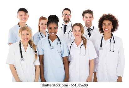 Portrait Of Smiling Multiracial Medical Team In Front Of White Background
