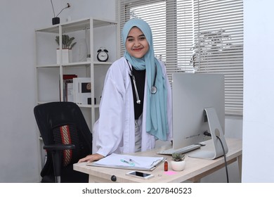 Portrait Of Smiling Muslim Female Doctor At Clinic