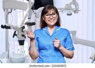 Portrait Of Smiling Nurse Looking At Camera In Dentistry